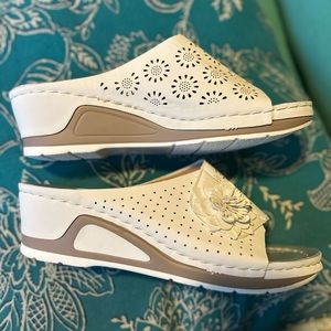 White slides with cutout detail